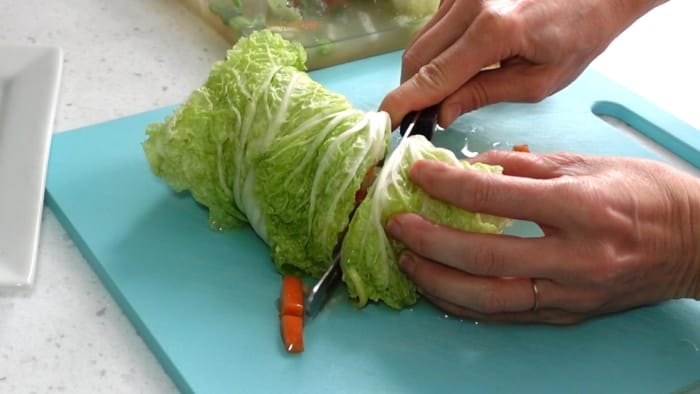 Slicing white kimchi cabbage bun
