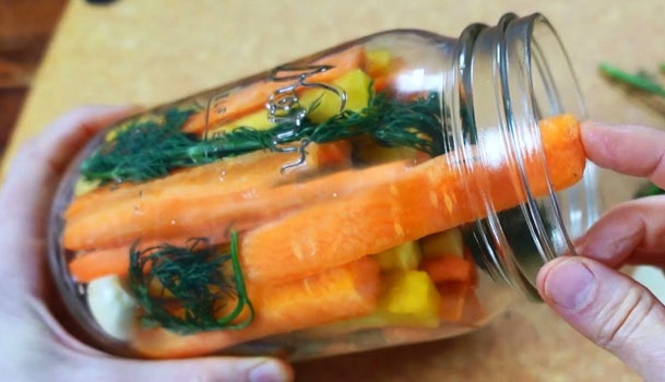 Loading the carrots into the jar